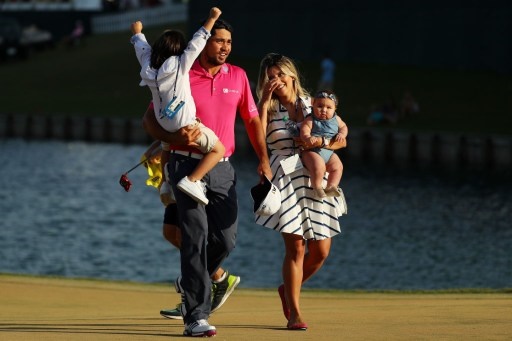 PONTE VEDRA BEACH, FL - MAY 15: Jason Day of Australia celebrates with son Dash, wife Ellie and daughter Lucy after winning during the final round of THE PLAYERS Championship at the Stadium course at TPC Sawgrass on May 15, 2016 in Ponte Vedra Beach, Florida. Mike Ehrmann/Getty Images/AFP