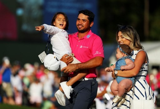 PONTE VEDRA BEACH, FL - MAY 15: Jason Day of Australia celebrates with son Dash, wife Ellie and daughter Lucy after winning during the final round of THE PLAYERS Championship at the Stadium course at TPC Sawgrass on May 15, 2016 in Ponte Vedra Beach, Florida. Scott Halleran/Getty Images/AFP