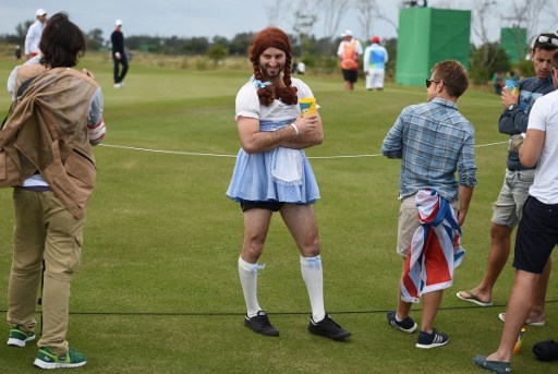 A fan disguised as Pippi Longstocking poses during the men's individual stroke play at the Olympic Golf course during the Rio 2016 Olympic Games in Rio de Janeiro on August 11, 2016. / AFP PHOTO / Jim WATSON