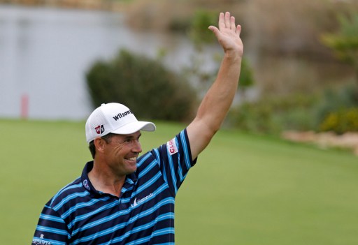 Irish golfer Padraig Harrington waves to the public after winning the Portugal Master golf tournament at Oceanico Victoria golf course in Vilamoura on October 23, 2016. / AFP PHOTO / JOSE MANUEL RIBEIRO