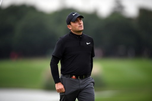 Francesco Molinari of Italy reacts on the 18th during the third round of the World Golf Championships-HSBC Champions golf tournament in Shanghai on October 29, 2016. / AFP PHOTO / JOHANNES EISELE