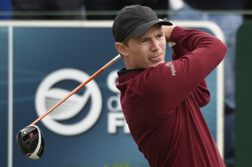 Danish Lasse Jensen plays off the 1st tee during the third round of the 100th French Golf Open on July 2, 2016 at Le Golf National in Guyancourt, near Paris. / AFP PHOTO / DOMINIQUE FAGET